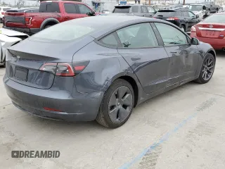 2023 Tesla Model 3 with VIN 5YJ3E1EA3PF697049, listed as a Copart auction lot 55601295 with 12,373 mi miles and Salvage Title. Bid and sale history available at DreamBid. Image 3.