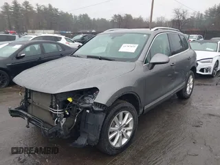 2013 Volkswagen Touareg Lux with VIN WVGEF9BP7DD007170, listed as a IAAI auction lot 41787075 with 131,089 mi miles and . Bid and sale history available at DreamBid. Image 2.