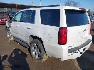 2020 Chevrolet Tahoe LT with VIN 1GNSKBKC1LR290889, listed as a IAAI auction lot 41492821 with 107,843 mi miles. Bid and sale history available at carsss.com. Image 3.