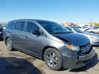 2012 Honda Odyssey EX-L with VIN 5FNRL5H64CB044075, listed as a IAAI auction lot 42094680 with 67,165 mi miles and . Bid and sale history available at carsss.com. Image 1.