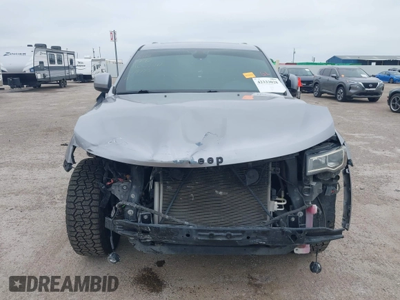 2019 Jeep Grand Cherokee Laredo E with VIN 1C4RJFAG9KC670974, listed as a IAAI auction lot 42333028 with 163,958 mi miles and . Bid and sale history available at DreamBid. Image 13.
