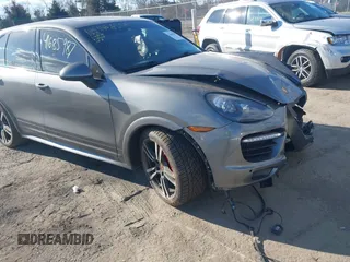 2014 Porsche Cayenne GTS z VIN WP1AD2A27ELA75187, wystawiony jako IAAI lot #41685987 z przebiegiem 77 962 mil mil oraz . Historia ofert i sprzedaży dostępna na DreamBid. Obrazek 1.