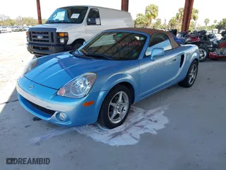 2003 Toyota MR2 Spyder with VIN JTDFR320130057360, listed as a IAAI auction lot 41696384 with 52,621 mi miles. Bid and sale history available at carsss.com. Image 2.