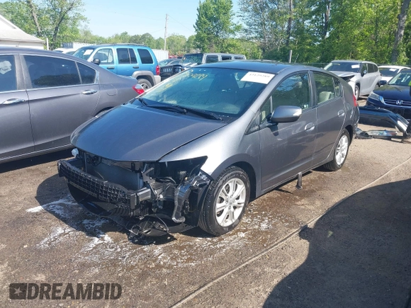 2010 Honda Insight EX with VIN JHMZE2H72AS021555, listed as a IAAI auction lot 42129289 with 172,829 mi miles and . Bid and sale history available at DreamBid. Image 18.