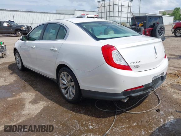 2014 Lincoln MKS z VIN 1LNHL9DK7EG601720, wystawiony jako IAAI lot #42464979 z przebiegiem 58 163 mil mil oraz . Historia ofert i sprzedaży dostępna na DreamBid. Obrazek 3.