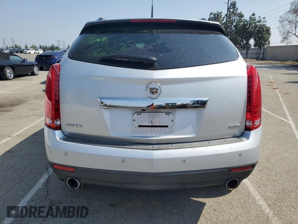 2013 Cadillac SRX Performance Collection z VIN 3GYFNDE38DS561321, wystawiony jako Copart lot #60237605 z przebiegiem 120 404 mil mil oraz Szkoda całkowita • Salvage title. Historia ofert i sprzedaży dostępna na DreamBid. Obrazek 6.