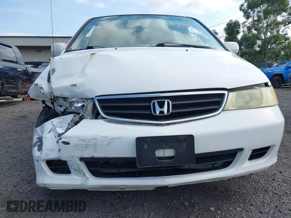2004 Honda Odyssey EX-L with VIN 5FNRL18924B064040, listed as a IAAI auction lot 41350306 with 130,803 mi miles and . Bid and sale history available at DreamBid. Image 14.