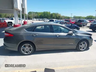 2016 Ford Fusion SE Hybrid with VIN 3FA6P0LU3GR127121, listed as a IAAI auction lot 41840795 with 88,281 mi miles. Bid and sale history available at carsss.com. Image 14.