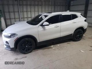 2022 BMW X2 xDrive28i z VIN WBXYJ1C04N5U30077, wystawiony jako Copart lot #52403385 z przebiegiem 74 924 mil mil oraz Szkoda całkowita • Salvage title. Historia ofert i sprzedaży dostępna na DreamBid. Obrazek 1.