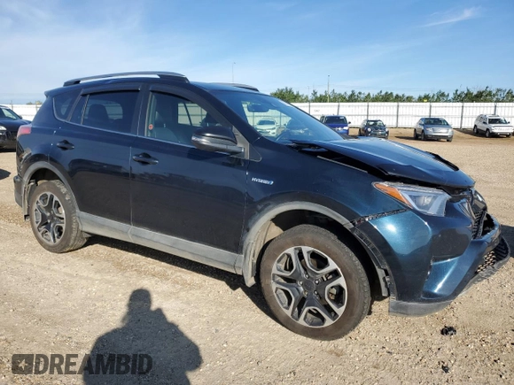 2018 Toyota RAV4 Hybrid SE with VIN JTMJJREV2JD230126, listed as a Copart auction lot 62574005 with 196,846 mi miles and Salvage title. Bid and sale history available at DreamBid. Image 4.