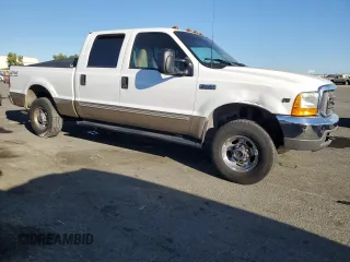 2000 Ford Super Duty F-250 XL with VIN 1FTNW21S1YED65639, listed as a Copart auction lot 74377194 with 158,387 mi miles and Salvage Title. Bid and sale history available at carsss.com. Image 4.