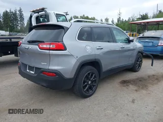 2014 Jeep Cherokee Latitude with VIN 1C4PJLCS1EW105984, listed as a IAAI auction lot 42242732 with 89,325 mi miles and . Bid and sale history available at DreamBid. Image 4.