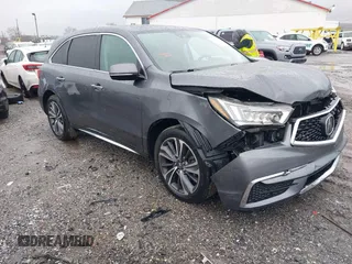 2019 Acura MDX Technology z VIN 5J8YD4H55KL025610, wystawiony jako IAAI lot #41966324 z przebiegiem 96 877 mil mil oraz . Historia ofert i sprzedaży dostępna na DreamBid. Obrazek 1.