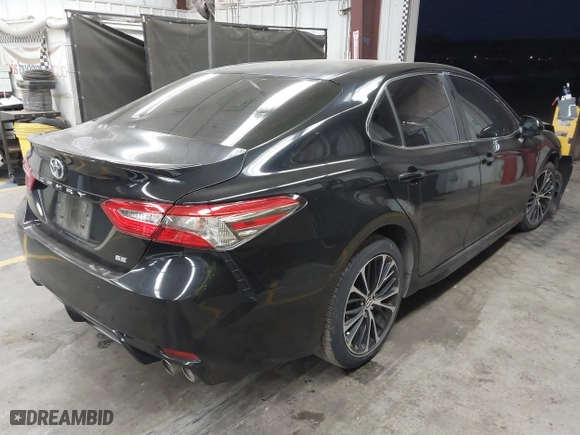 2018 Toyota Camry LE with VIN JTNB11HKXJ3048974, listed as a IAAI auction lot 41879941 with 102,377 mi miles. Bid and sale history available at carsss.com. Image 4.