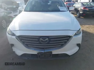2021 Mazda CX-9 Touring with VIN JM3TCBCY1M0507696, listed as a IAAI auction lot 41681192 with 69,330 mi miles. Bid and sale history available at carsss.com. Image 13.