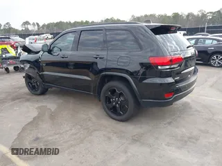 2019 Jeep Grand Cherokee Laredo E with VIN 1C4RJEAGXKC571770, listed as a IAAI auction lot 41677487 with 113,089 mi miles. Bid and sale history available at carsss.com. Image 3.