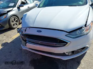 2018 Ford Fusion S with VIN 3FA6P0G76JR270334, listed as a IAAI auction lot 41490738 with 98,920 mi miles. Bid and sale history available at carsss.com. Image 6.