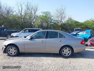 2003 Mercedes-Benz E-Class 3.2L with VIN WDBUF65J93X099223, listed as a IAAI auction lot 42033473 with 230,758 mi miles. Bid and sale history available at carsss.com. Image 14.
