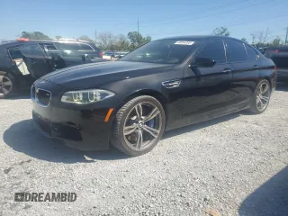 2014 BMW M5 with VIN WBSFV9C52ED593005, listed as a Copart auction lot 49054395 with 71,213 mi miles and Salvage Title. Bid and sale history available at carsss.com. Image 1.