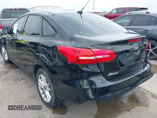 2018 Ford Focus SE with VIN 1FADP3F22JL311975, listed as a IAAI auction lot 41934856 with 68,974 mi miles. Bid and sale history available at carsss.com. Image 3.