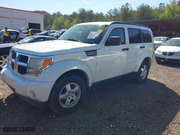 2009 Dodge Nitro SE with VIN 1D8GT28K19W518279, listed as a IAAI auction lot 41855238 with 186,607 mi miles. Bid and sale history available at carsss.com. Image 2.