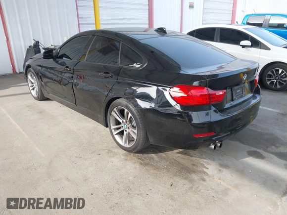 2015 BMW 4 Series 428i with VIN WBA4A9C52FGL85228, listed as a IAAI auction lot 41228043 with 152,729 mi miles and . Bid and sale history available at DreamBid. Image 3.