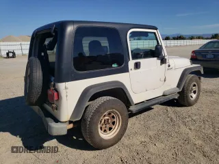2006 Jeep Wrangler Sport Right Hand Drive with VIN 1J4F449S76P747454, listed as a Copart auction lot 77819214 with 184,763 mi miles and Salvage Title. Bid and sale history available at carsss.com. Image 3.