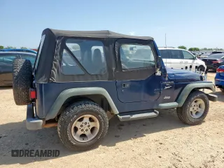 2000 Jeep Wrangler Sport with VIN 1J4FA49S9YP742414, listed as a Copart auction lot 61471065 with 139,572 mi miles and Clean title. Bid and sale history available at DreamBid. Image 3.