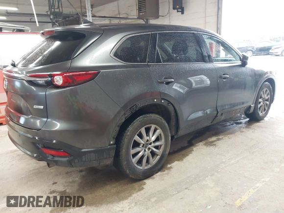 2017 Mazda CX-9 Touring with VIN JM3TCBCY1H0127229, listed as a IAAI auction lot 42320263 with 85,890 mi miles and . Bid and sale history available at DreamBid. Image 4.