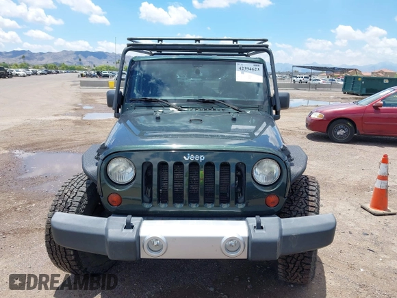 2012 Jeep Wrangler Sahara z VIN 1C4AJWBGXCL100527, wystawiony jako IAAI lot #42394623 z przebiegiem 126 097 mil mil oraz . Historia ofert i sprzedaży dostępna na DreamBid. Obrazek 12.