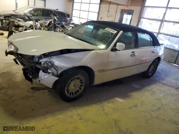 2002 Lincoln Town Car Cartier with VIN 1LNHM83W22Y662670, listed as a Copart auction lot 83526144 with 75,072 mi miles and Salvage Title. Bid and sale history available at carsss.com. Image 1.
