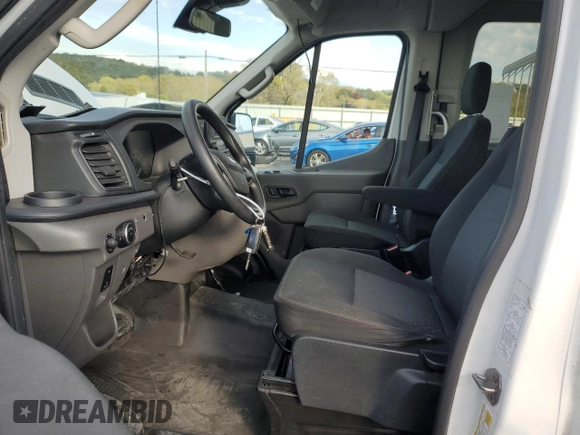 2021 Ford Transit with VIN 1FDAX2CG2MKA23709, listed as a Copart auction lot 74054214 with 105,503 mi miles and Salvage Title. Bid and sale history available at DreamBid. Image 7.