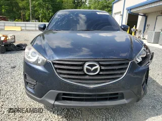 2016 Mazda CX-5 Sport z VIN JM3KE4BY8G0837052, wystawiony jako Copart lot #54700235 z przebiegiem 124 172 mil mil oraz Szkoda całkowita • Salvage title. Historia ofert i sprzedaży dostępna na DreamBid. Obrazek 5.