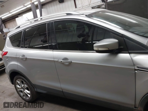 2015 Ford Escape Titanium with VIN 1FMCU0J96FUB81598, listed as a IAAI auction lot 41872114 with 122,001 mi miles and . Bid and sale history available at DreamBid. Image 13.