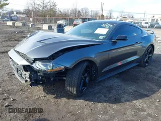 2021 Ford Mustang EcoBoost with VIN 1FA6P8TH4M5136345, listed as a IAAI auction lot 41503885 with 18,853 mi miles. Bid and sale history available at carsss.com. Image 2.