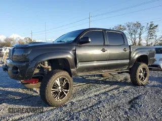 2009 Toyota Tacoma PreRunner with VIN 3TMJU62N19M086594, listed as a Copart auction lot 87074924 with 211,200 mi miles and Salvage Title. Bid and sale history available at carsss.com. Image 1.