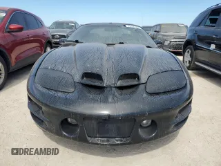 2000 Pontiac Firebird Formula z VIN 2G2FV22G9Y2140113, wystawiony jako Copart lot #76135324 z przebiegiem Nie podano mil oraz Szkody całkowita. Historia ofert i sprzedaży dostępna na DreamBid. Obrazek 5.