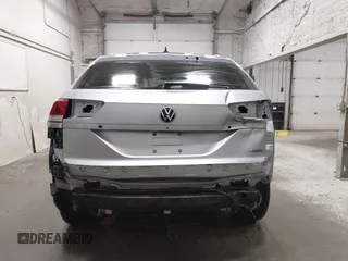 2023 Volkswagen Atlas SE z VIN 1V2KC2CA6PC210593, wystawiony jako IAAI lot #41957633 z przebiegiem 34 801 mil mil oraz . Historia ofert i sprzedaży dostępna na DreamBid. Obrazek 17.
