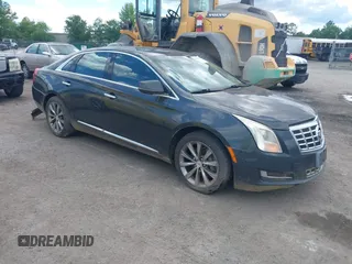 2013 Cadillac XTS z VIN 2G61N5S34D9124510, wystawiony jako IAAI lot #42294343 z przebiegiem 202 938 mil mil oraz . Historia ofert i sprzedaży dostępna na DreamBid. Obrazek 1.