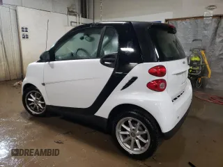 2009 Smart fortwo Pure z VIN WMEEJ31X69K258431, wystawiony jako Copart lot #43870485 z przebiegiem 64 935 mil mil oraz Szkoda całkowita • Salvage title. Historia ofert i sprzedaży dostępna na DreamBid. Obrazek 2.