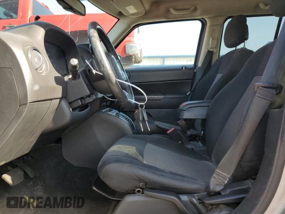 2015 Jeep Patriot Latitude with VIN 1C4NJPFB1FD157025, listed as a Copart auction lot 52310155 with 132,752 mi miles and Salvage title. Bid and sale history available at DreamBid. Image 7.