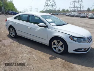 2013 Volkswagen CC Sport with VIN WVWBP7AN0DE523261, listed as a IAAI auction lot 42106039 with 136,105 mi miles. Bid and sale history available at carsss.com. Image 1.