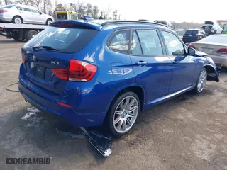 2015 BMW X1 sDrive28i with VIN WBAVM1C58FV314947, listed as a IAAI auction lot 41874472 with 128,271 mi miles. Bid and sale history available at carsss.com. Image 4.