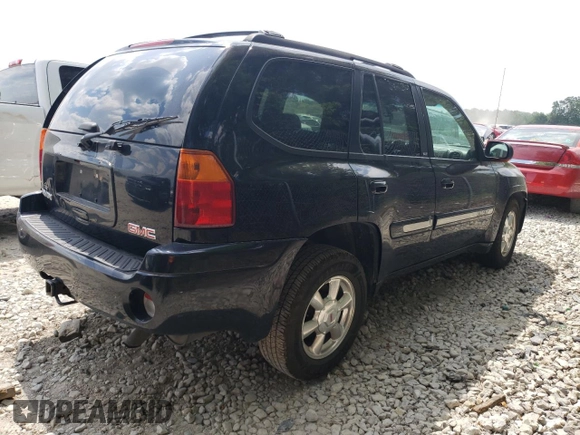 2004 GMC Envoy SLT with VIN 1GKDT13S042281050, listed as a Copart auction lot 60024304 with 267,205 mi miles and Salvage Title. Bid and sale history available at carsss.com. Image 3.