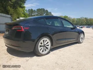 2023 Tesla Model 3 with VIN 5YJ3E1EA2PF438438, listed as a Copart auction lot 52901375 with 63,181 mi miles and Salvage Title. Bid and sale history available at carsss.com. Image 3.