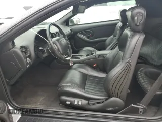 2002 Pontiac Firebird Trans Am z VIN 2G2FV32GX22126136, wystawiony jako Copart lot #74893254 z przebiegiem 7725 mil mil oraz Szkody całkowita. Historia ofert i sprzedaży dostępna na DreamBid. Obrazek 7.