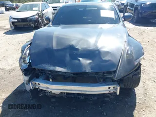 2009 Nissan 370Z z VIN JN1AZ44E19M405896, wystawiony jako IAAI lot #41889553 z przebiegiem 202 388 mil mil oraz . Historia ofert i sprzedaży dostępna na DreamBid. Obrazek 6.