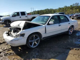 2001 Mercury Grand Marquis LS with VIN 2MEFM75WX1X672959, listed as a Copart auction lot 50189775 with 104,812 mi miles and Salvage Title. Bid and sale history available at DreamBid. Image 1.