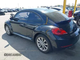 2017 Volkswagen Beetle 1.8T SE with VIN 3VWJ17ATXHM612411, listed as a IAAI auction lot 41900371 with 101,419 mi miles. Bid and sale history available at carsss.com. Image 3.