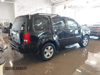 2011 Honda Pilot EX with VIN 5FNYF3H48BB055911, listed as a IAAI auction lot 41364335 with 165,445 mi miles and . Bid and sale history available at carsss.com. Image 4.
